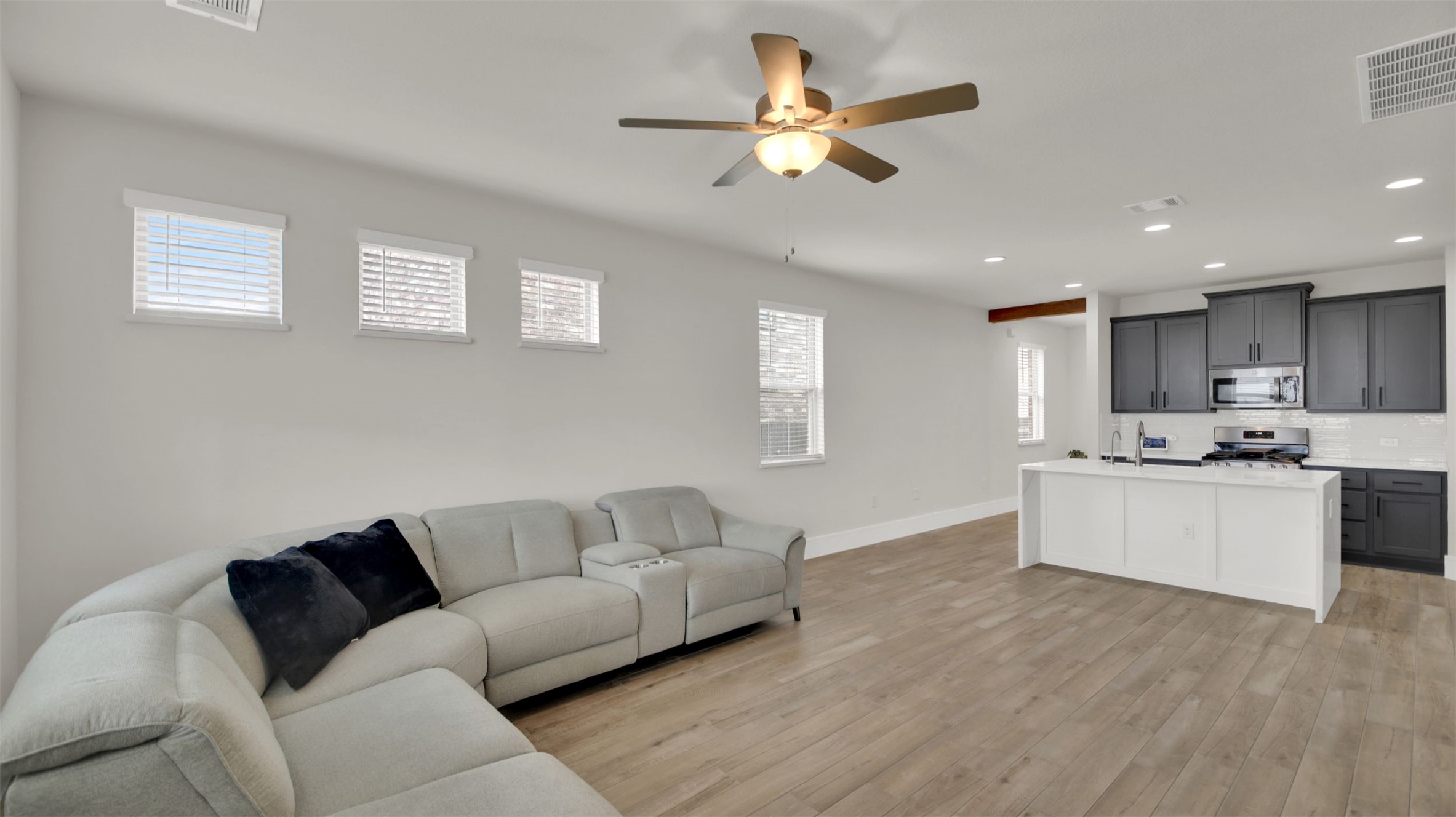 964 Pepperbark Loop Buda, TX 78610 - Photo 13 of 35 Living room featuring light wood finished floors, recessed lighting, and a ceiling fan