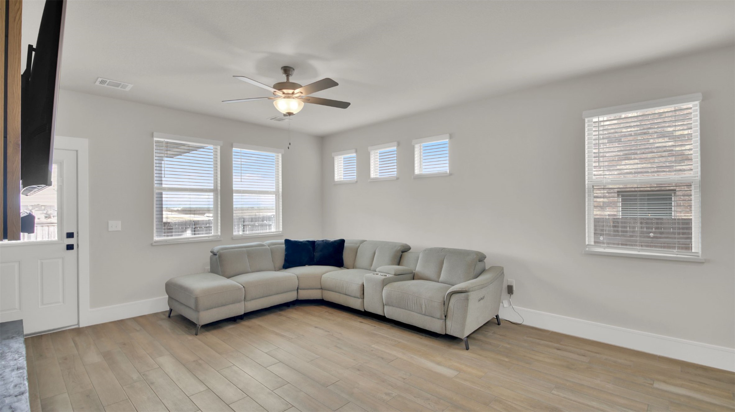964 Pepperbark Loop Buda, TX 78610 - Photo 14 of 35 Living room with light wood-type flooring and ceiling fan