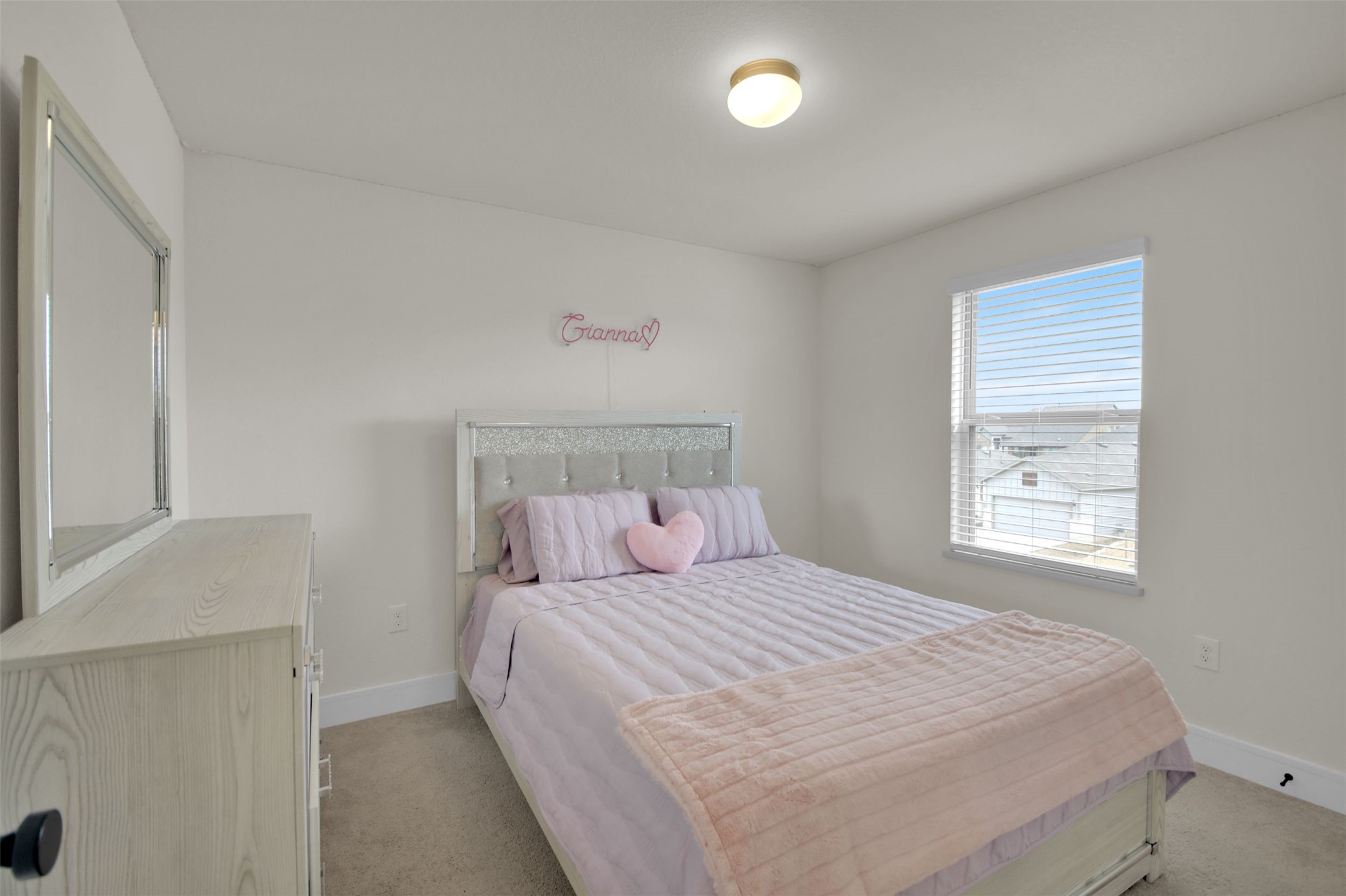 964 Pepperbark Loop Buda, TX 78610 - Photo 15 of 23 Bedroom featuring light colored carpet and baseboards