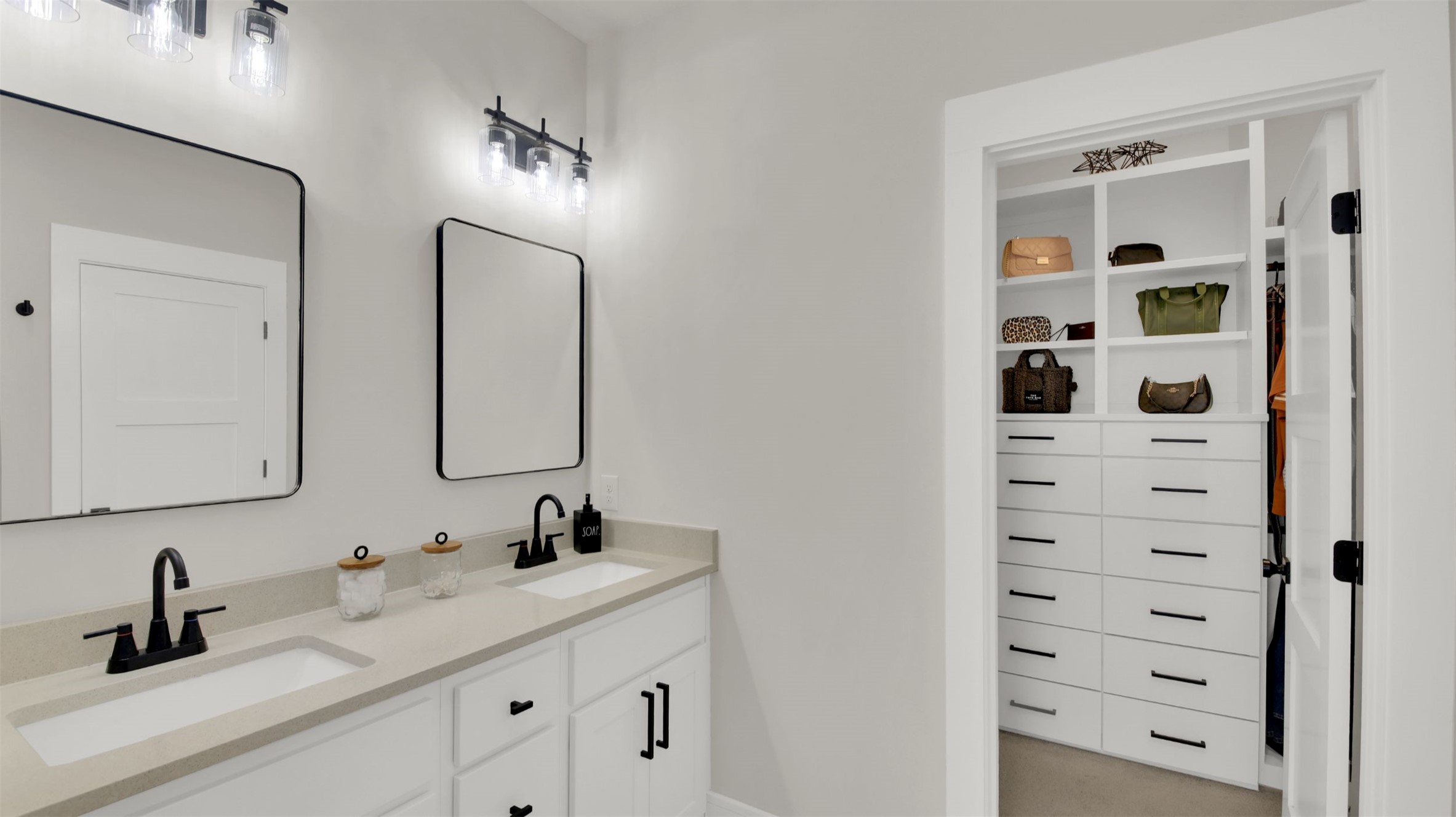 964 Pepperbark Loop Buda, TX 78610 - Photo 19 of 35 Full bath featuring double vanity and a walk in closet