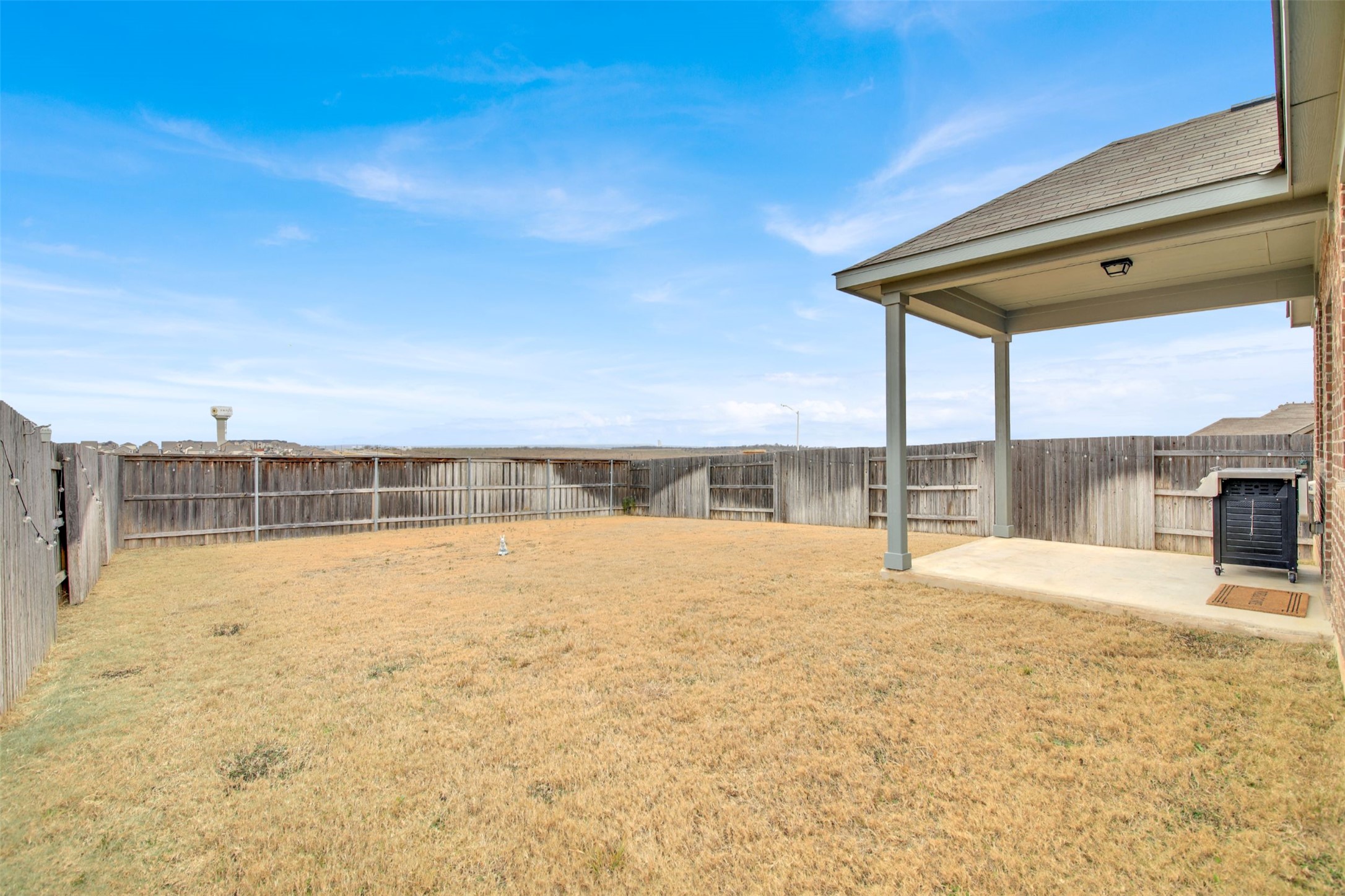 964 Pepperbark Loop Buda, TX 78610 - Photo 22 of 23 Fenced backyard with a patio area