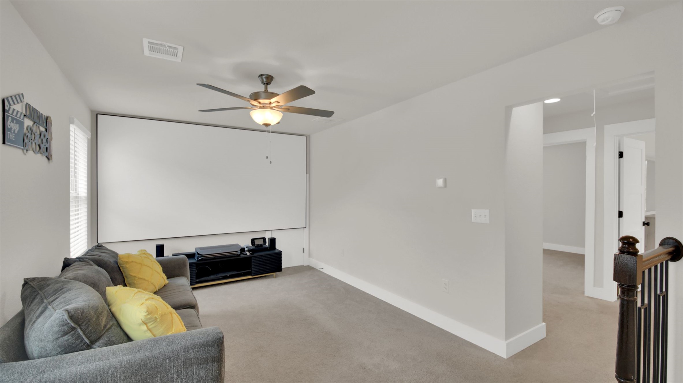 964 Pepperbark Loop Buda, TX 78610 - Photo 25 of 35 Carpeted cinema room featuring a ceiling fan and baseboards