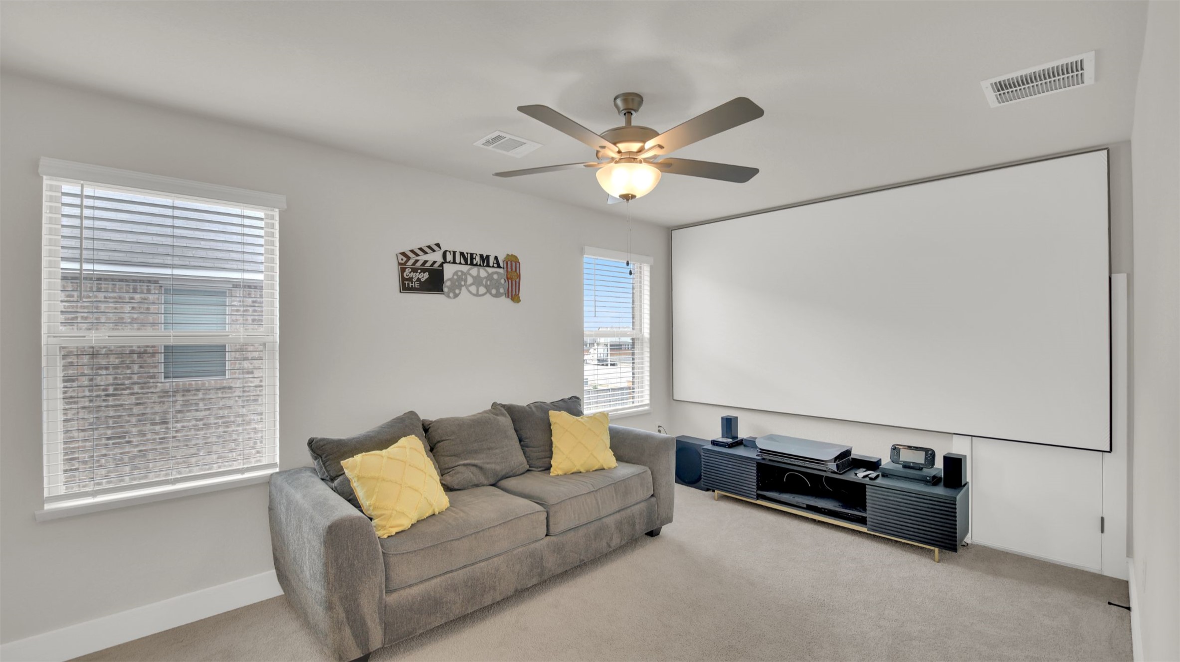 964 Pepperbark Loop Buda, TX 78610 - Photo 26 of 35 Carpeted home theater room with ceiling fan and baseboards