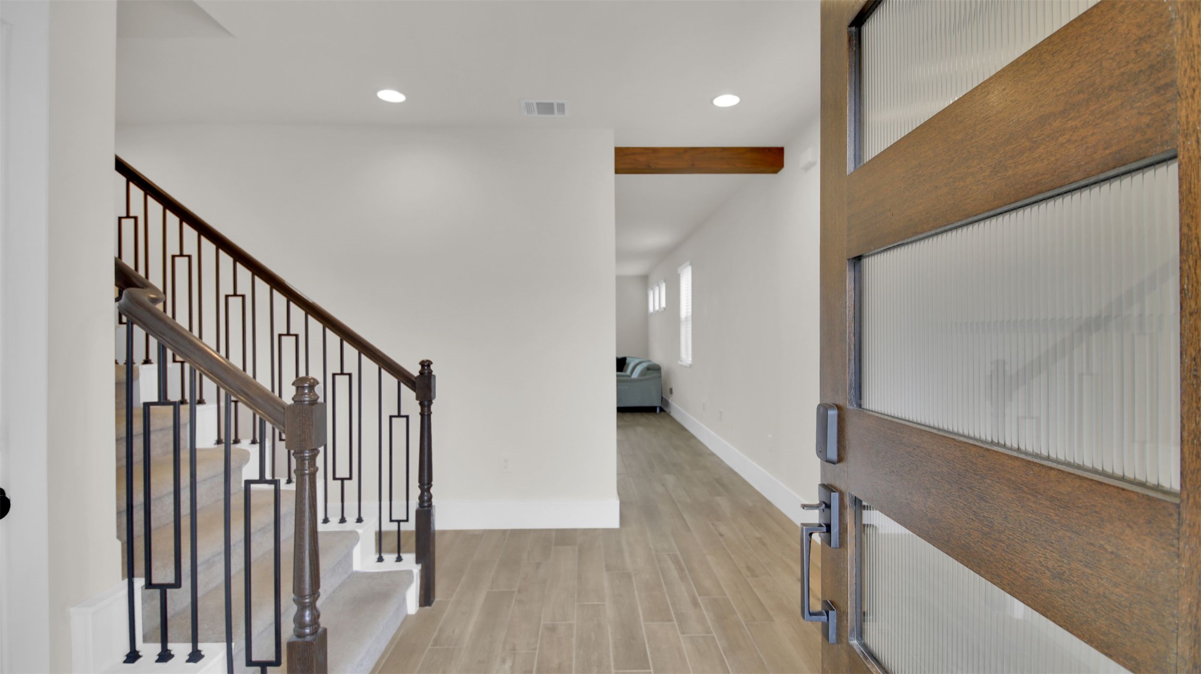 964 Pepperbark Loop Buda, TX 78610 - Photo 4 of 35 Foyer entrance with light wood-type flooring, recessed lighting, and beam ceiling
