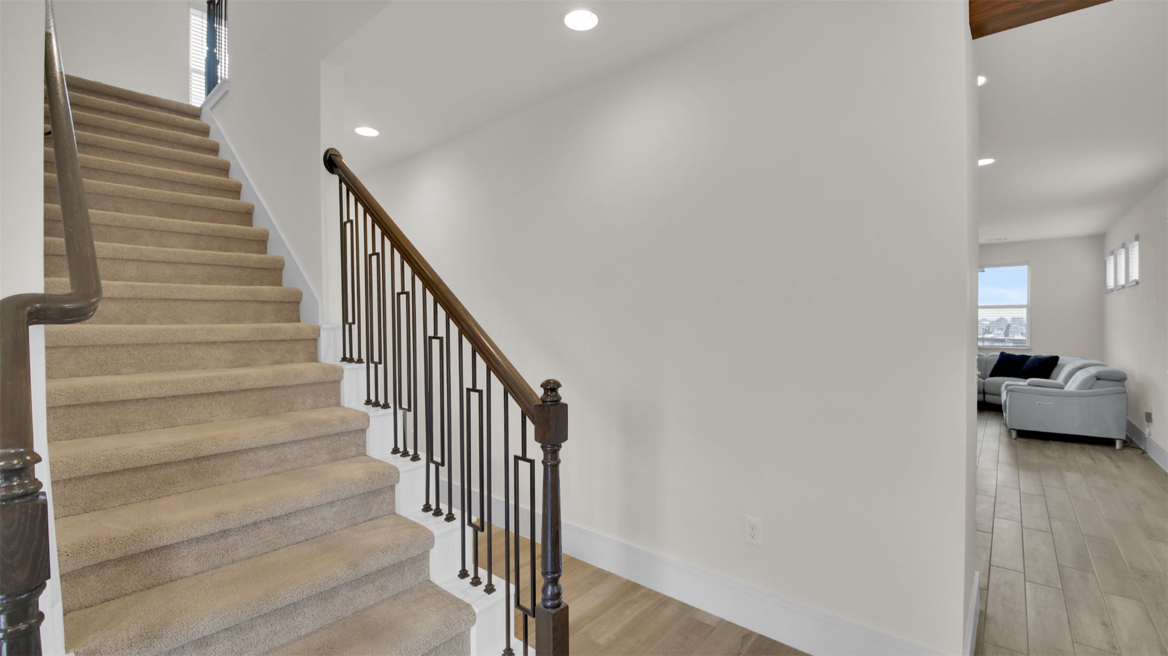964 Pepperbark Loop Buda, TX 78610 - Photo 5 of 35 Stairs with wood finished floors and recessed lighting
