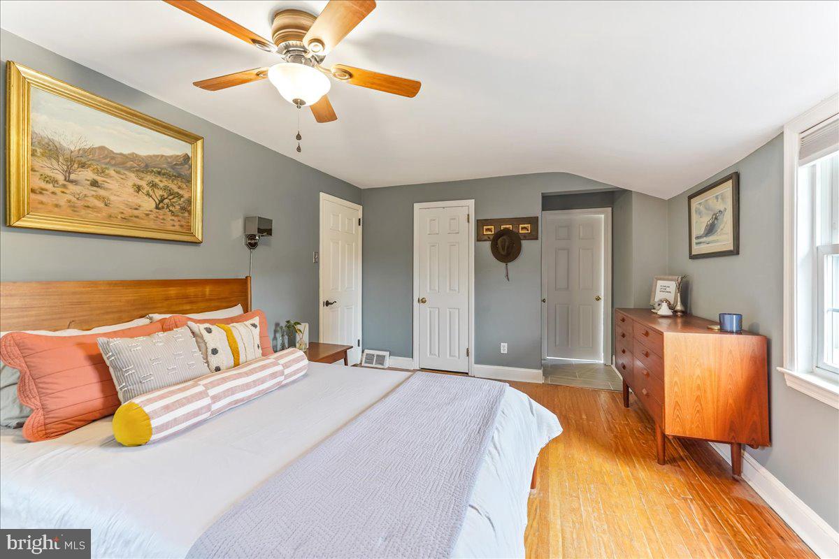 42 Preston Road Media, PA 19063 - Photo 21 of 35 a bedroom with a bed and a chandelier
