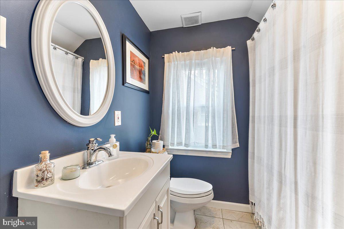 42 Preston Road Media, PA 19063 - Photo 24 of 35 a bathroom with a sink and a mirror