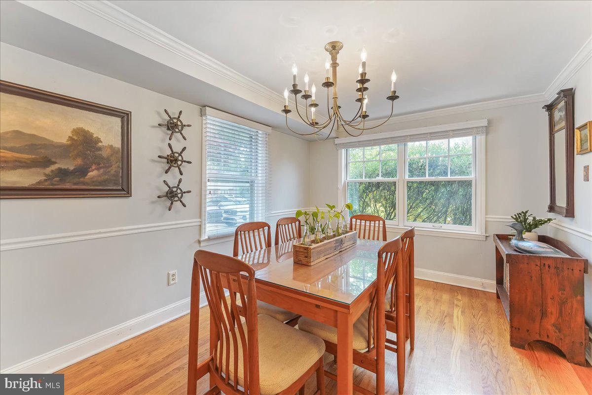 42 Preston Road Media, PA 19063 - Photo 6 of 35 a view of a dining room with furniture a chandelier and wooden floor