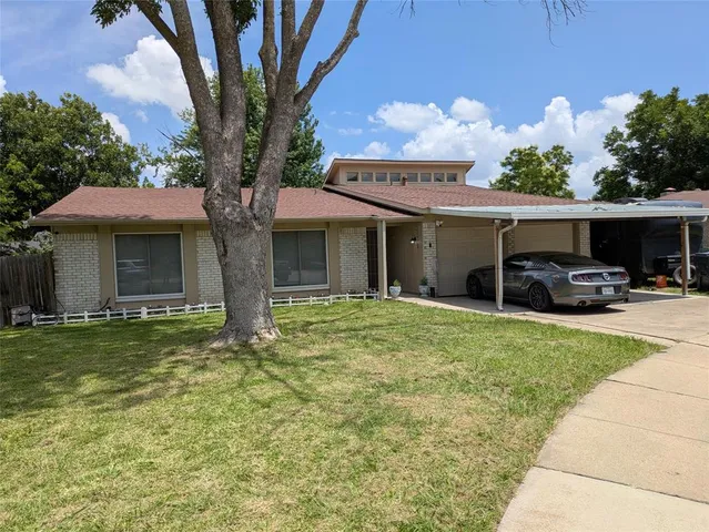 a front view of a house with a garden and porch