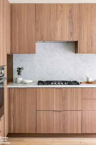 a view of a kitchen with wooden floor
