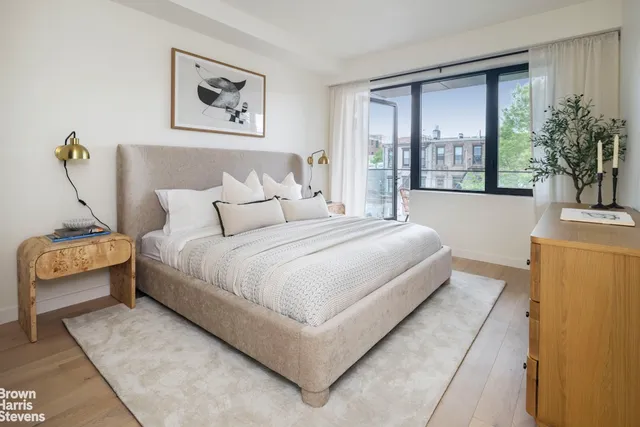 a bedroom with bed and balcony