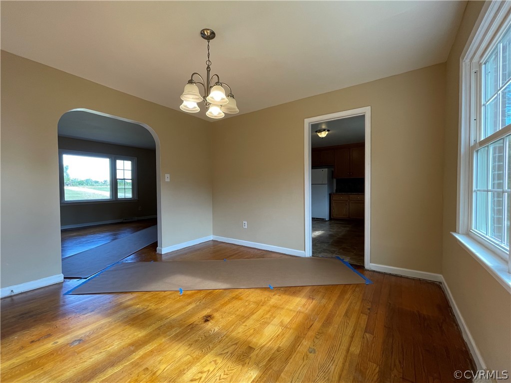 298 John Randolph Road Farmville, VA 23901 - Photo 12 of 50 a view of a livingroom with a chandelier fan and kitchen view