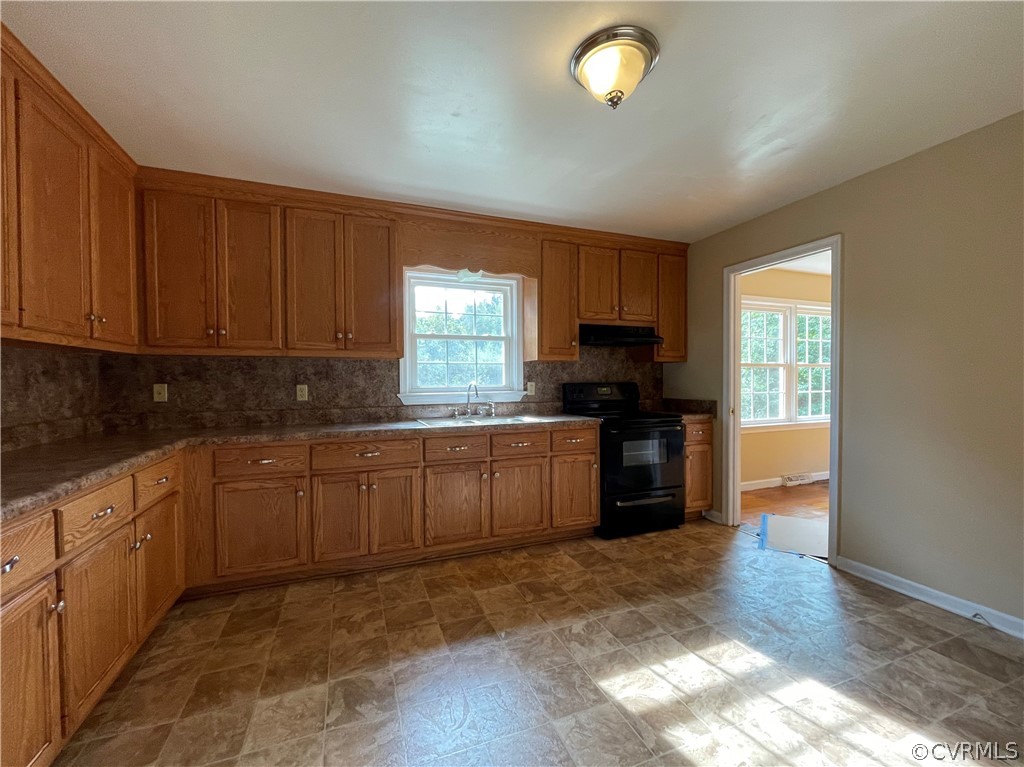 298 John Randolph Road Farmville, VA 23901 - Photo 16 of 50 a kitchen with a window and cabinets