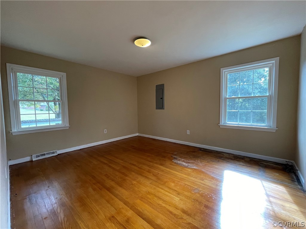 298 John Randolph Road Farmville, VA 23901 - Photo 18 of 50 a view of an empty room with wooden floor and a window