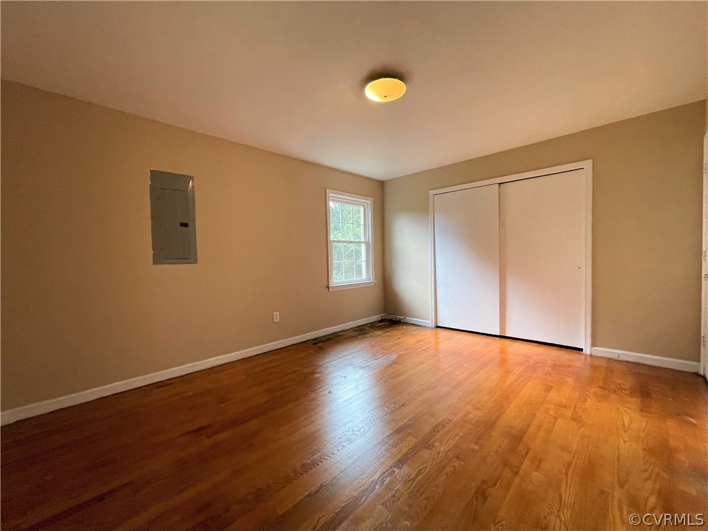 298 John Randolph Road Farmville, VA 23901 - Photo 19 of 50 a view of an empty room with wooden floor and a window