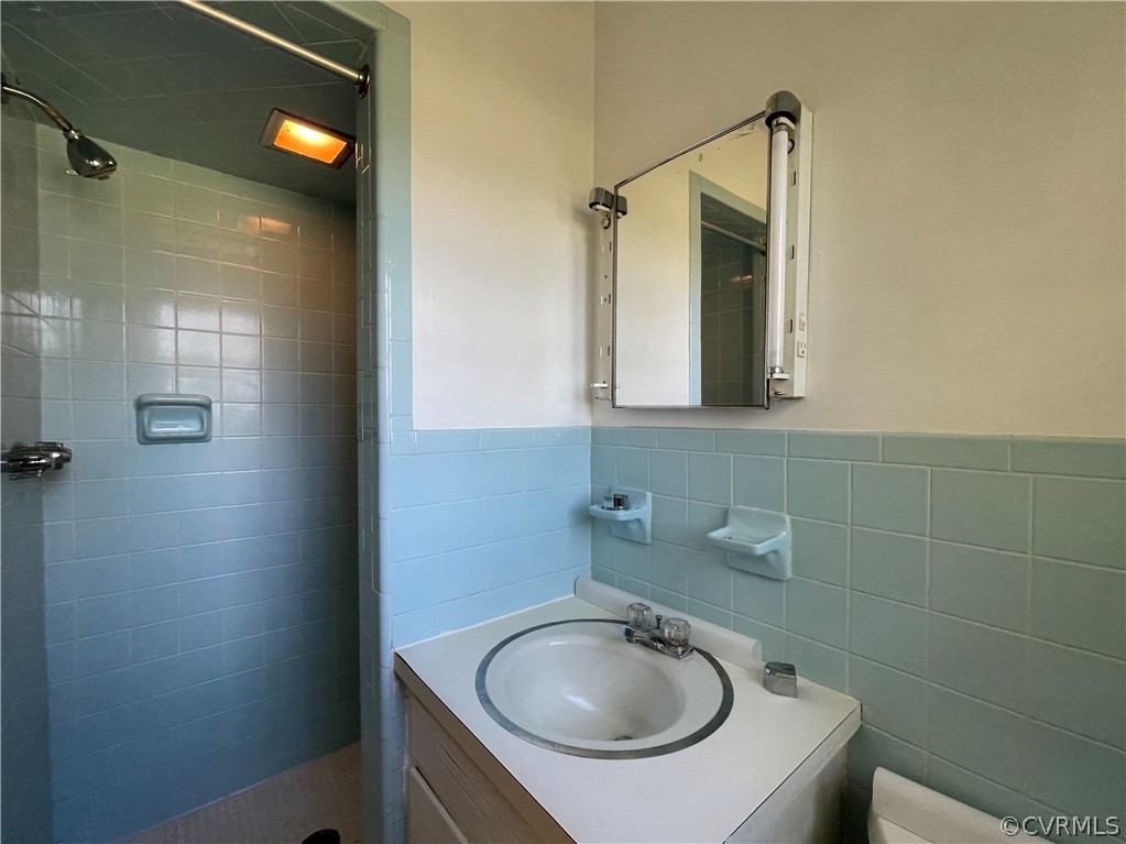 298 John Randolph Road Farmville, VA 23901 - Photo 21 of 50 a bathroom with a sink a toilet and shower