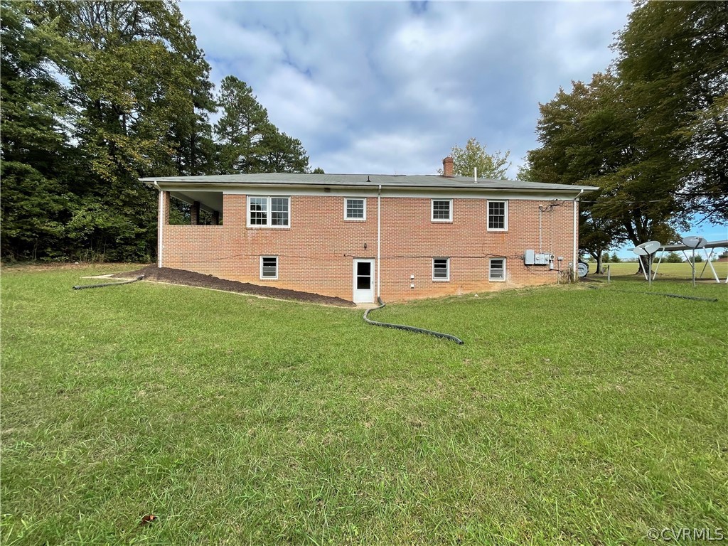 298 John Randolph Road Farmville, VA 23901 - Photo 49 of 50 a front view of house with yard and trees in the background