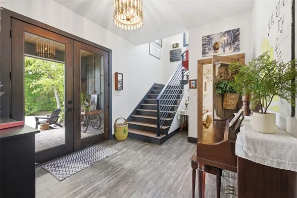 a dining room with a wooden table and chairs