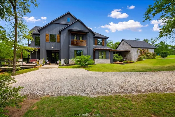 an aerial view of a house with outdoor space and street view
