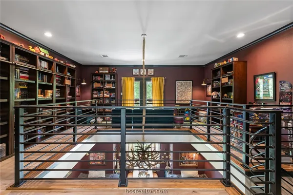 a bathroom with a toilet and a shower curtain