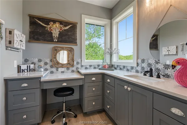 a bathroom with a toilet and a shower curtain