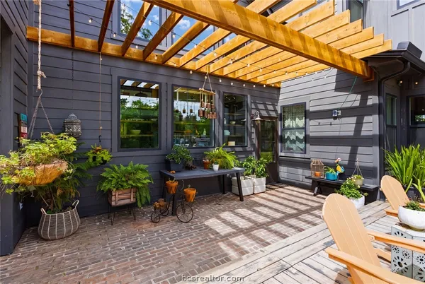 a living room with furniture fireplace and a flat screen tv