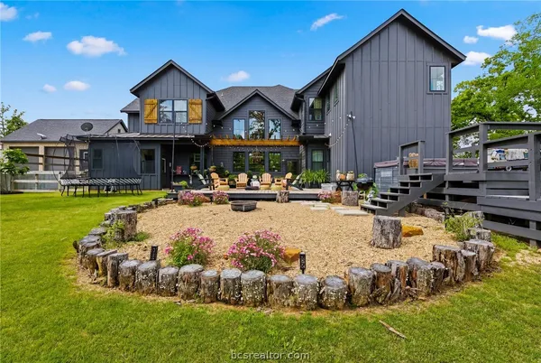 a bedroom with furniture and a wooden floor