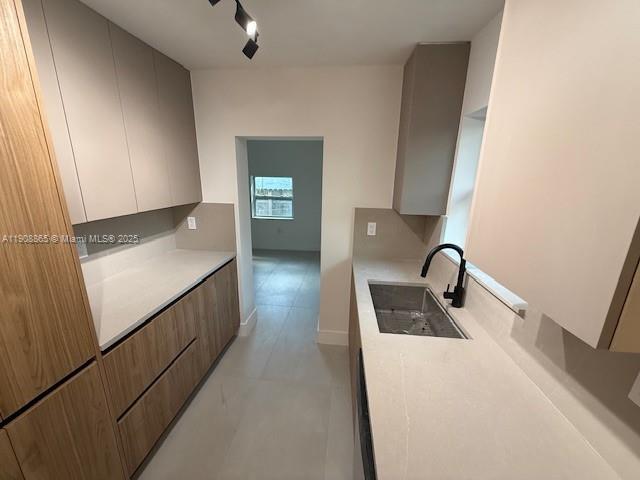 328 Northeast 57th Street Miami, FL 33137 - Photo 3 of 15 a kitchen with sink a faucet and appliances