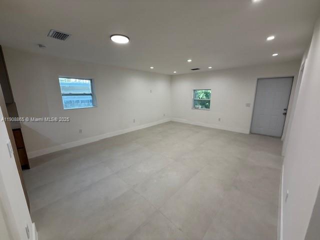 328 Northeast 57th Street Miami, FL 33137 - Photo 5 of 15 an empty room with a window