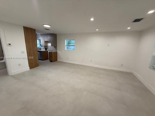 328 Northeast 57th Street Miami, FL 33137 - Photo 8 of 15 an empty room with furniture and a view