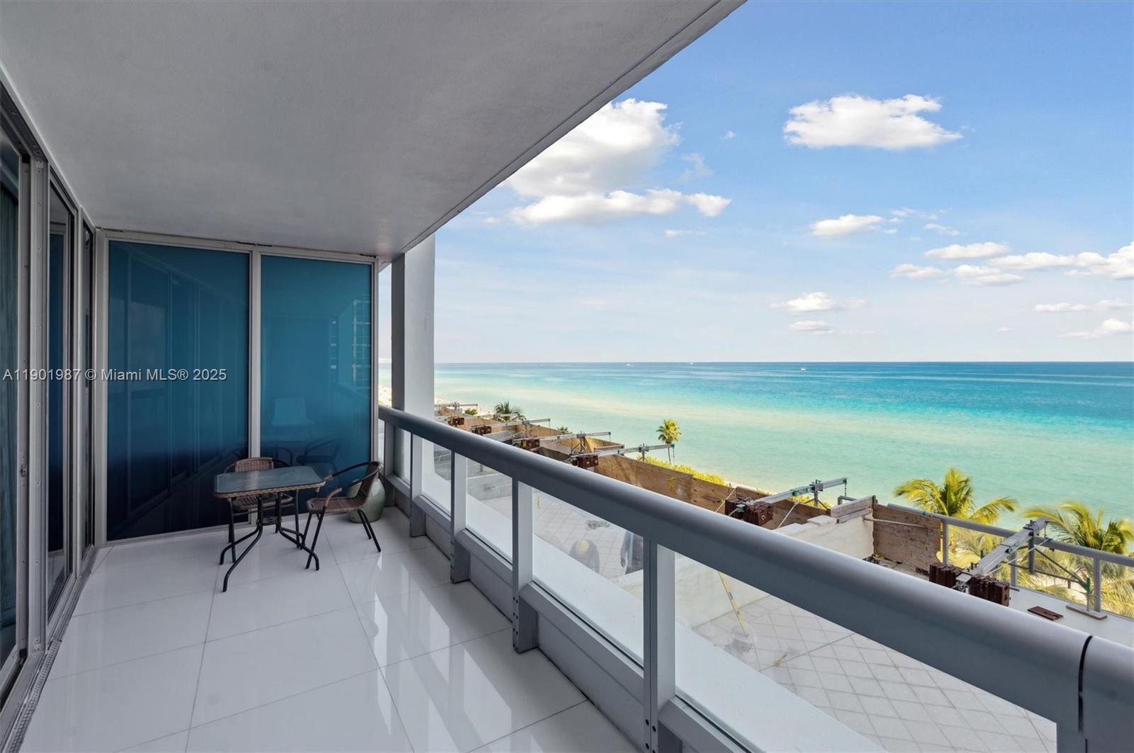 6899 Collins Avenue, Unit 702 Miami Beach, FL 33141 - Photo 1 of 47 a balcony with furniture and city view