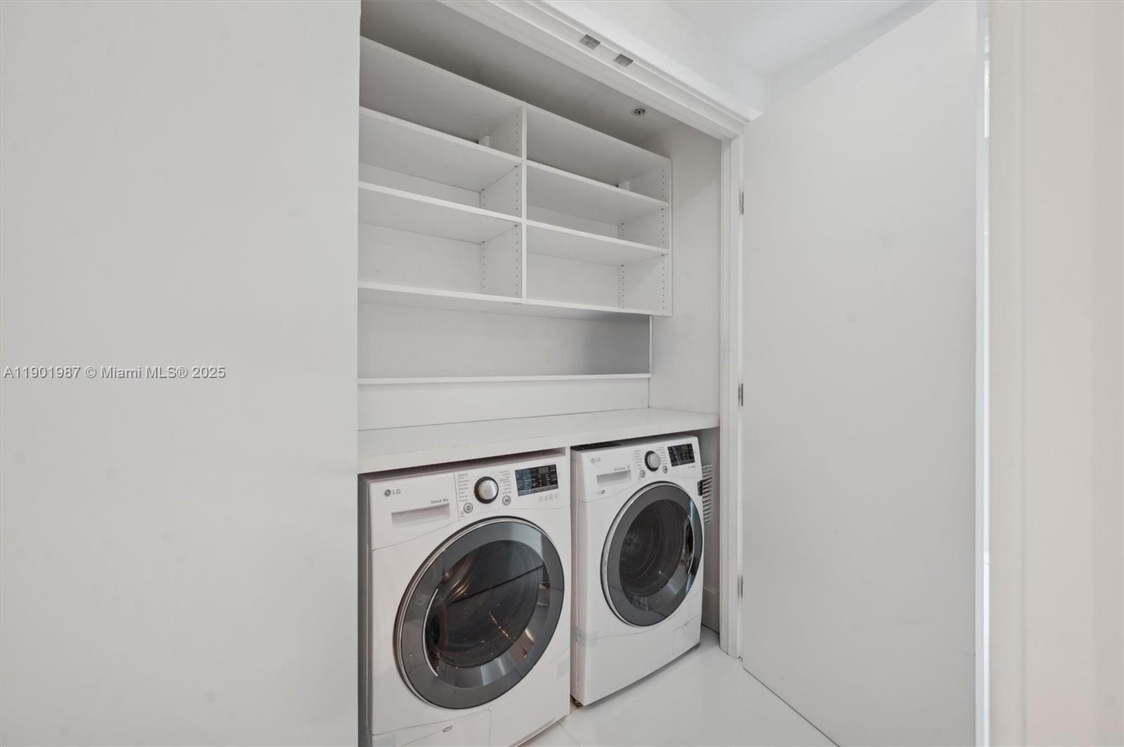 6899 Collins Avenue, Unit 702 Miami Beach, FL 33141 - Photo 22 of 47 a utility room with dryer and washer