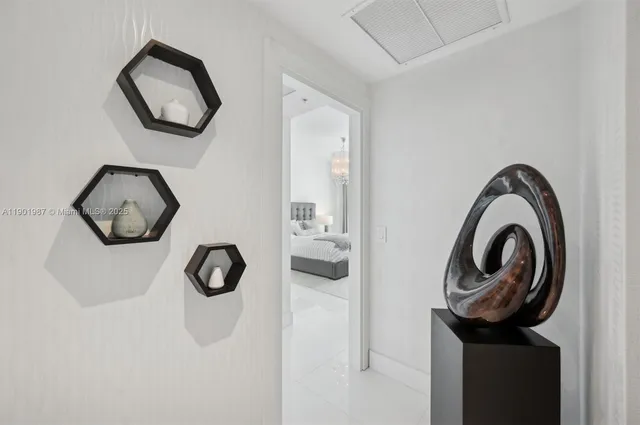 a bathroom with a shower and a glass door