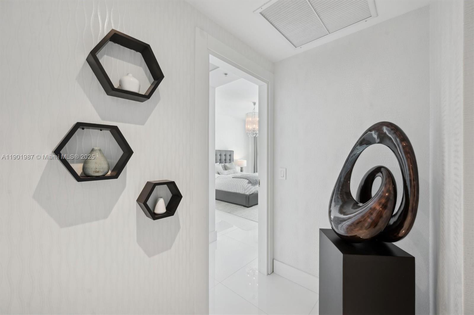 6899 Collins Avenue, Unit 702 Miami Beach, FL 33141 - Photo 23 of 47 a picture of a bathroom with a sink and a mirror