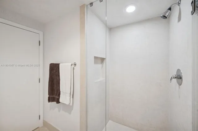 a bathroom with a sink toilet and a mirror