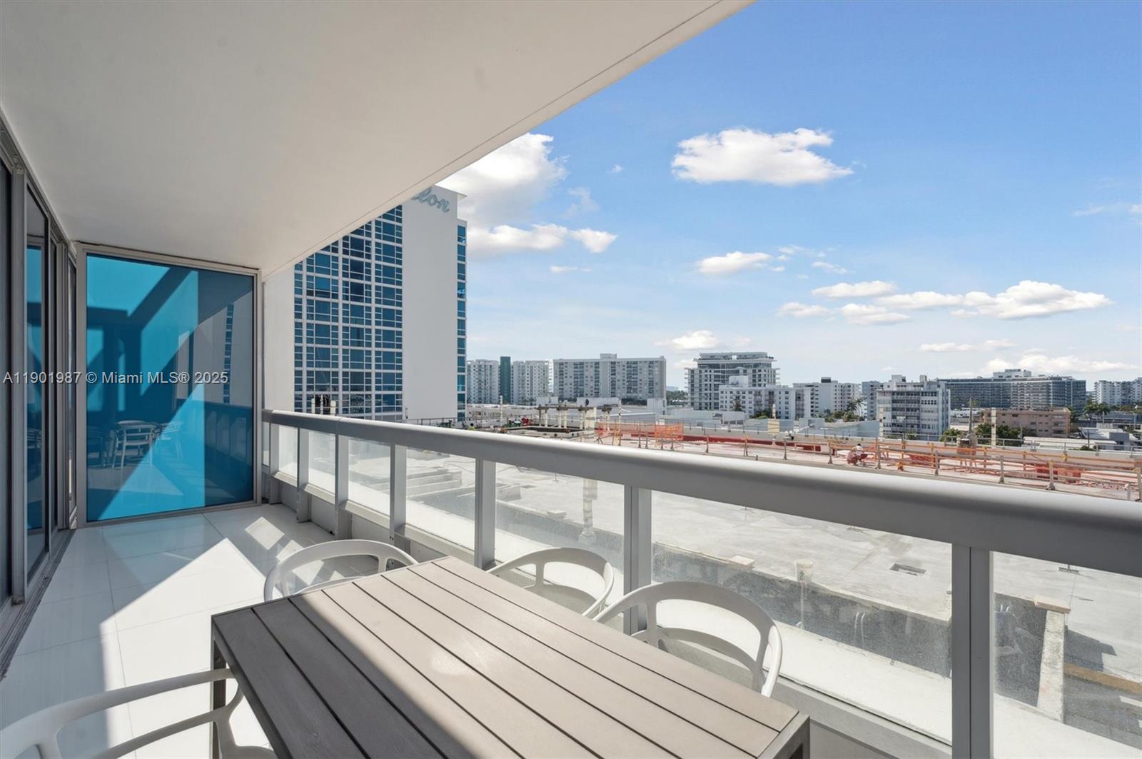 6899 Collins Avenue, Unit 702 Miami Beach, FL 33141 - Photo 28 of 47 a view of a balcony with wooden floor