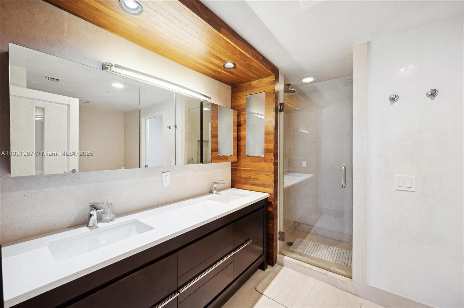 6899 Collins Avenue, Unit 702 Miami Beach, FL 33141 - Photo 35 of 47 a bathroom with a sink and a mirror