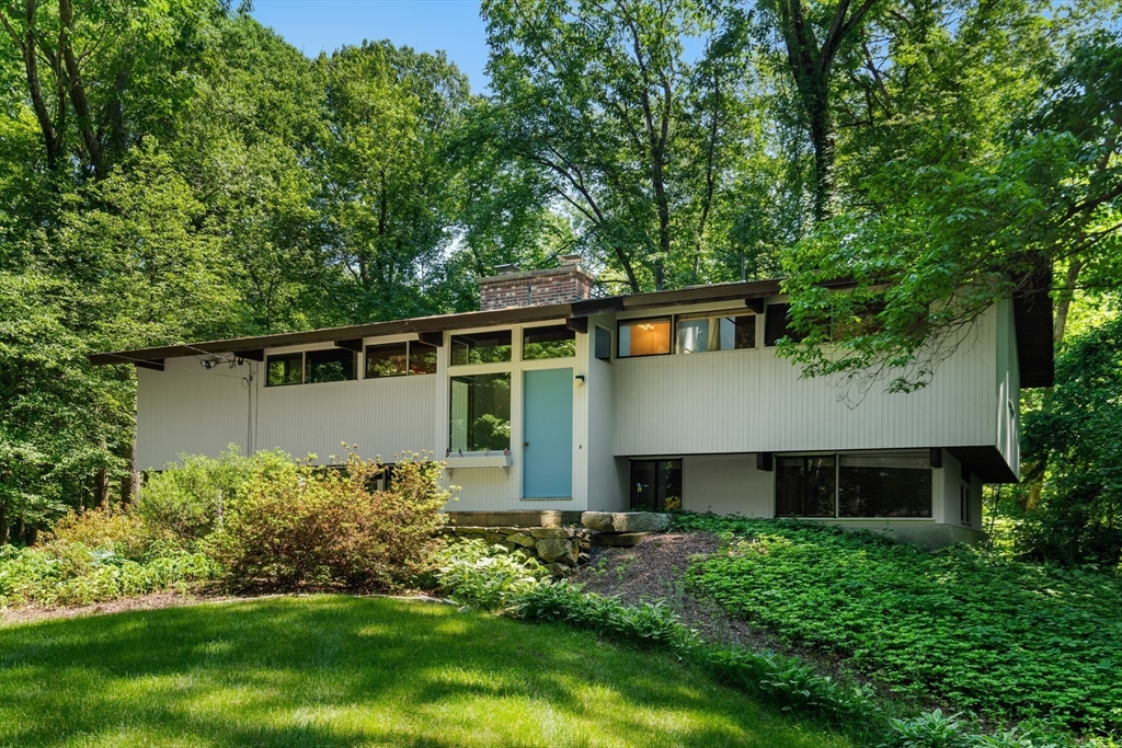 35 Sedgemeadow Road Wayland, MA 01778 - Photo 2 of 29 a front view of a house with a garden
