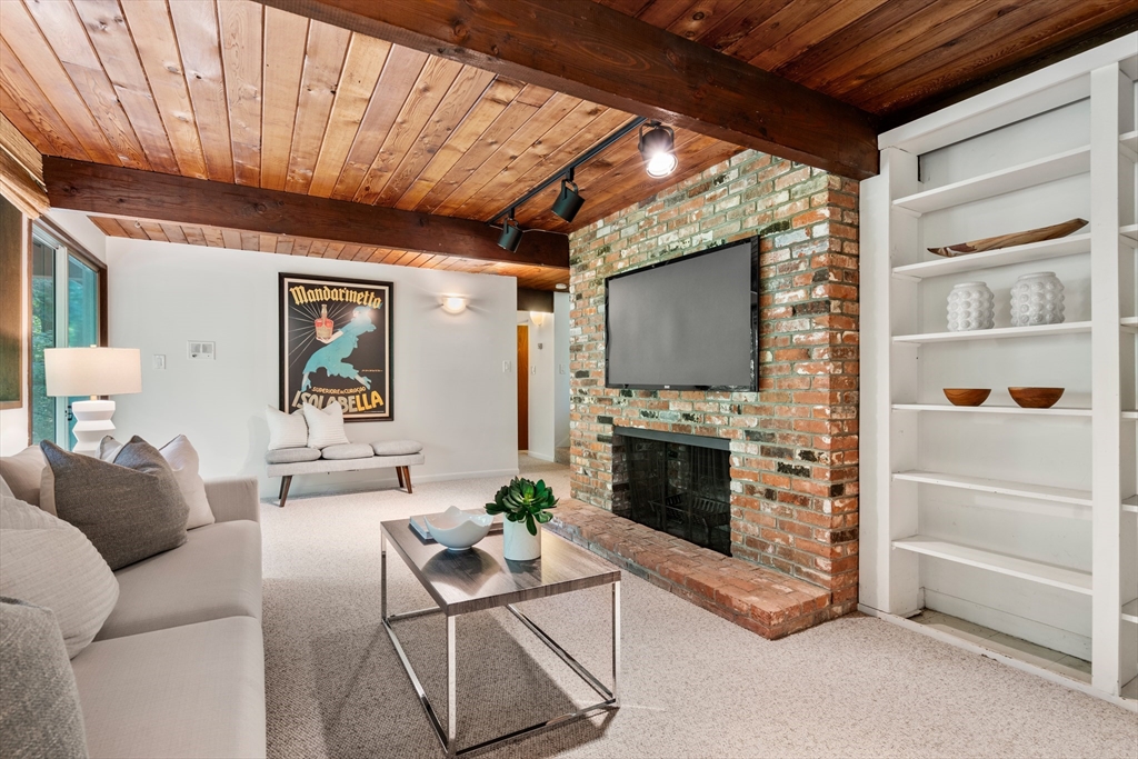 35 Sedgemeadow Road Wayland, MA 01778 - Photo 25 of 29 a living room with furniture and a fireplace