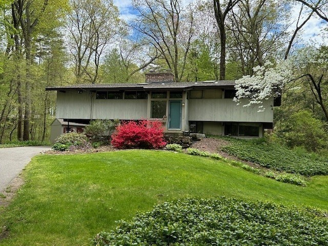 35 Sedgemeadow Road Wayland, MA 01778 - Photo 29 of 29 a front view of a house with a garden
