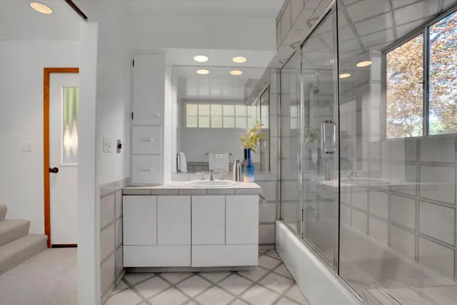 a view of deck in the backyard with seating space