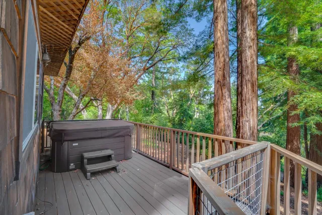 a view of balcony with deck and trees