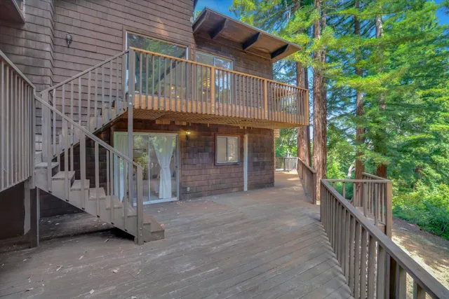 a bathroom with a sink mirror and shower