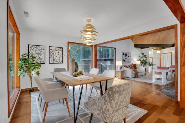 a kitchen with stainless steel appliances granite countertop a sink a stove and a refrigerator