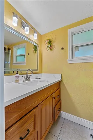 a bathroom with a sink and a mirror
