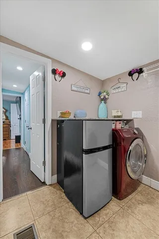a kitchen with stainless steel appliances granite countertop a refrigerator and a stove