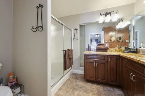 a bathroom with a sink vanity and a mirror