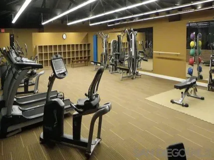 a view of a dining room with furniture and a flat screen tv