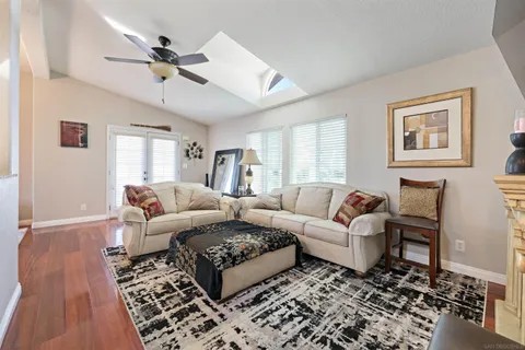 a living room with furniture and a rug