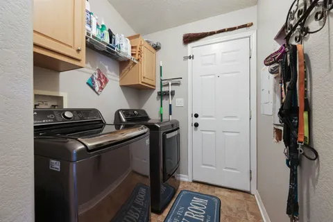 a kitchen with stainless steel appliances a stove and a refrigerator